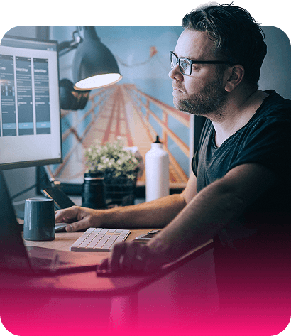 Person working on laptop by window
